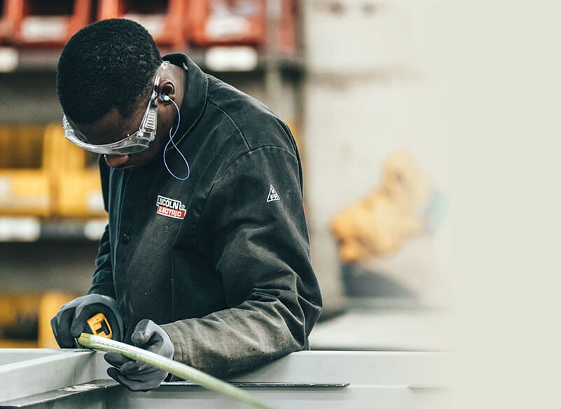 Men holding wire for repair