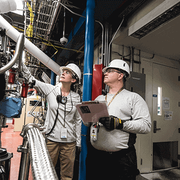 Manager and his worker review work done on ship repair Manager and his worker review work done on ship repair